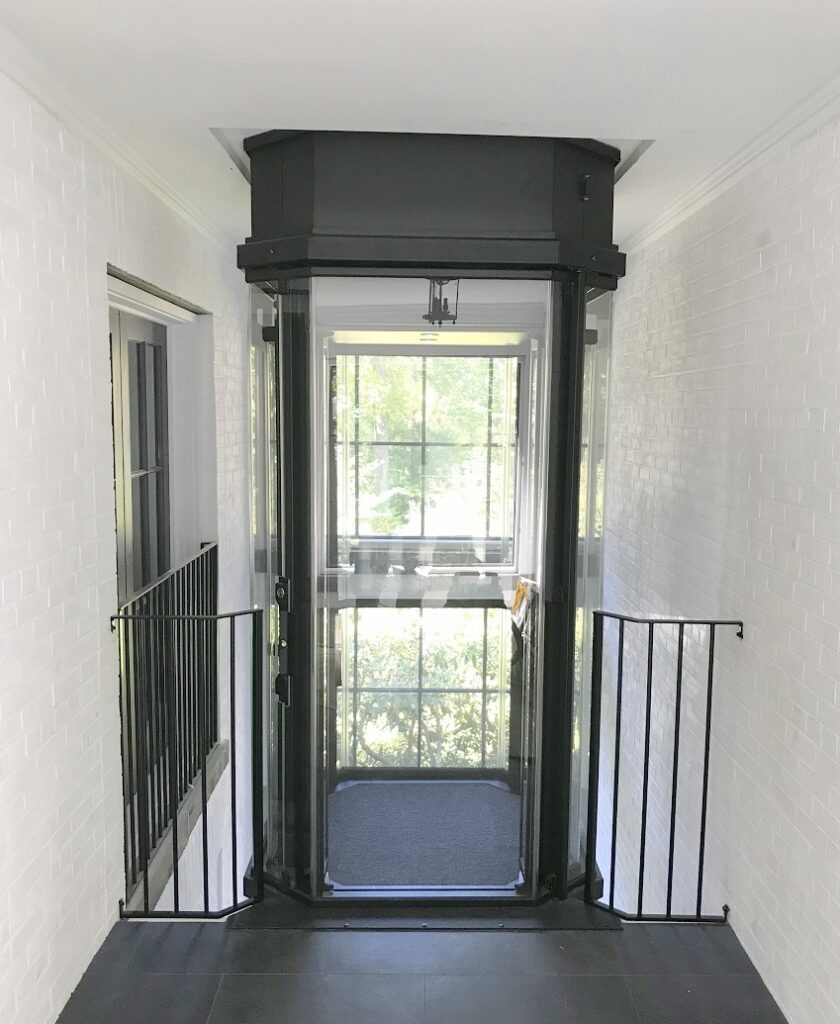 Glass Residential Elevator waiting at the top of a home in New Jersey