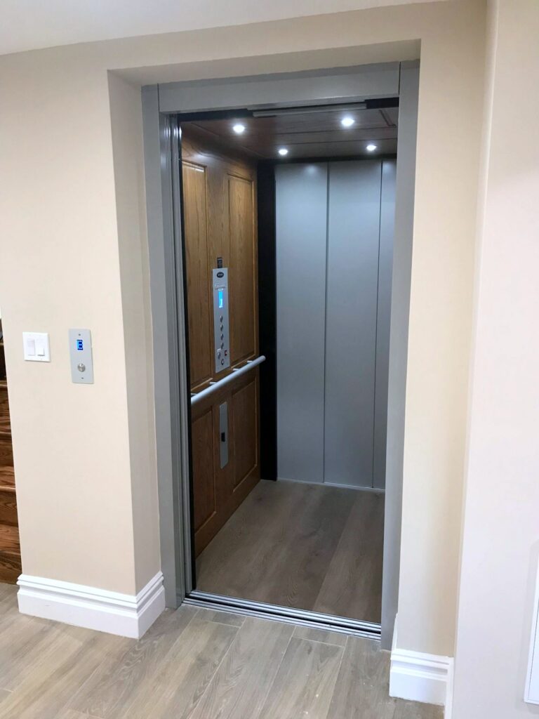 Note the unique styling of this home elevator from zenith with a classic metal cab.